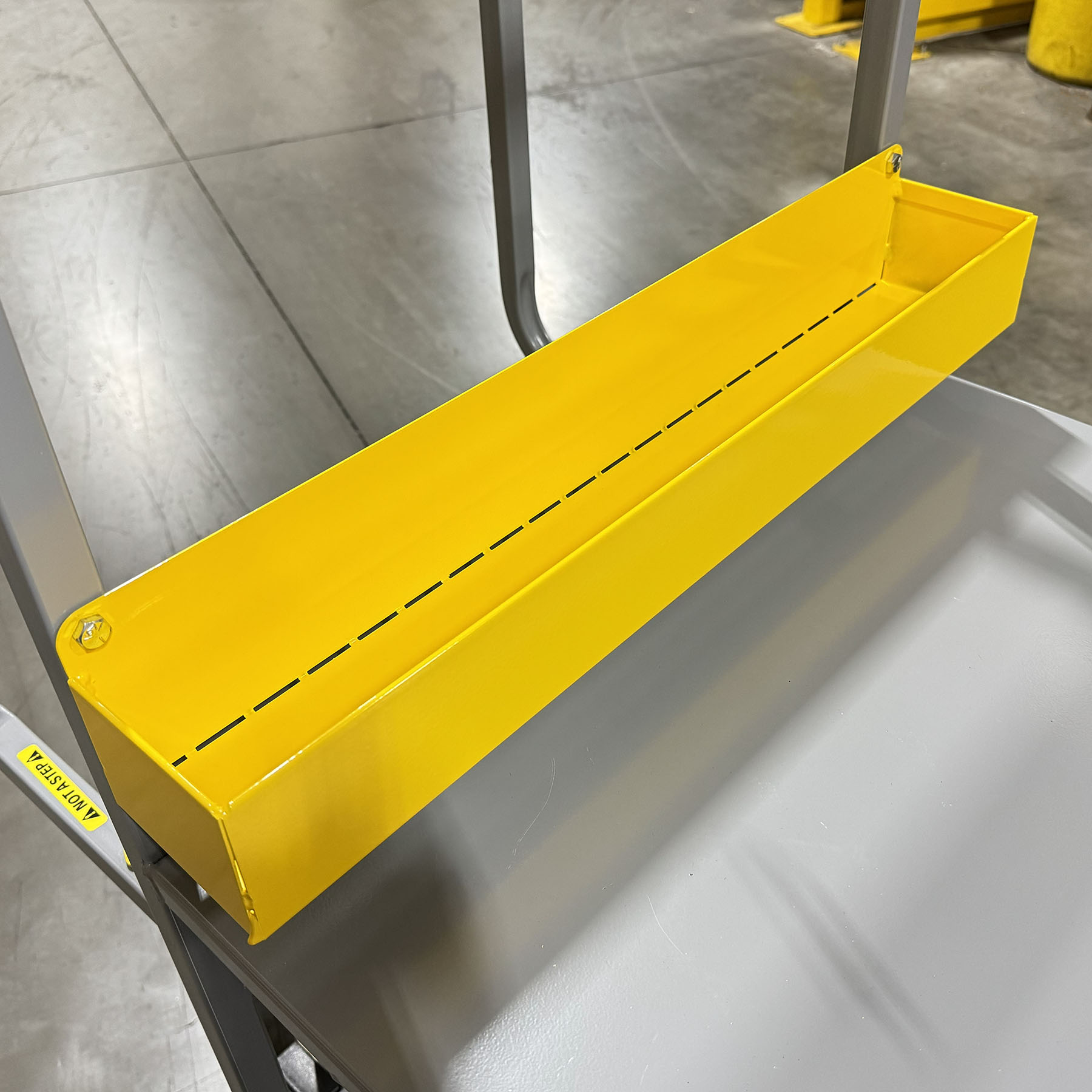 Adhesive. Top step has rough tape and perforated first step aid in stability. With ergonomic handles, dual shelves, and a highly stable six-wheel design, this cart keeps product organized and operators moving efficiently. Add custom accessories like hooks, bins, dividers, or scanner holders to create a tailored solution that fits your operation perfectly.