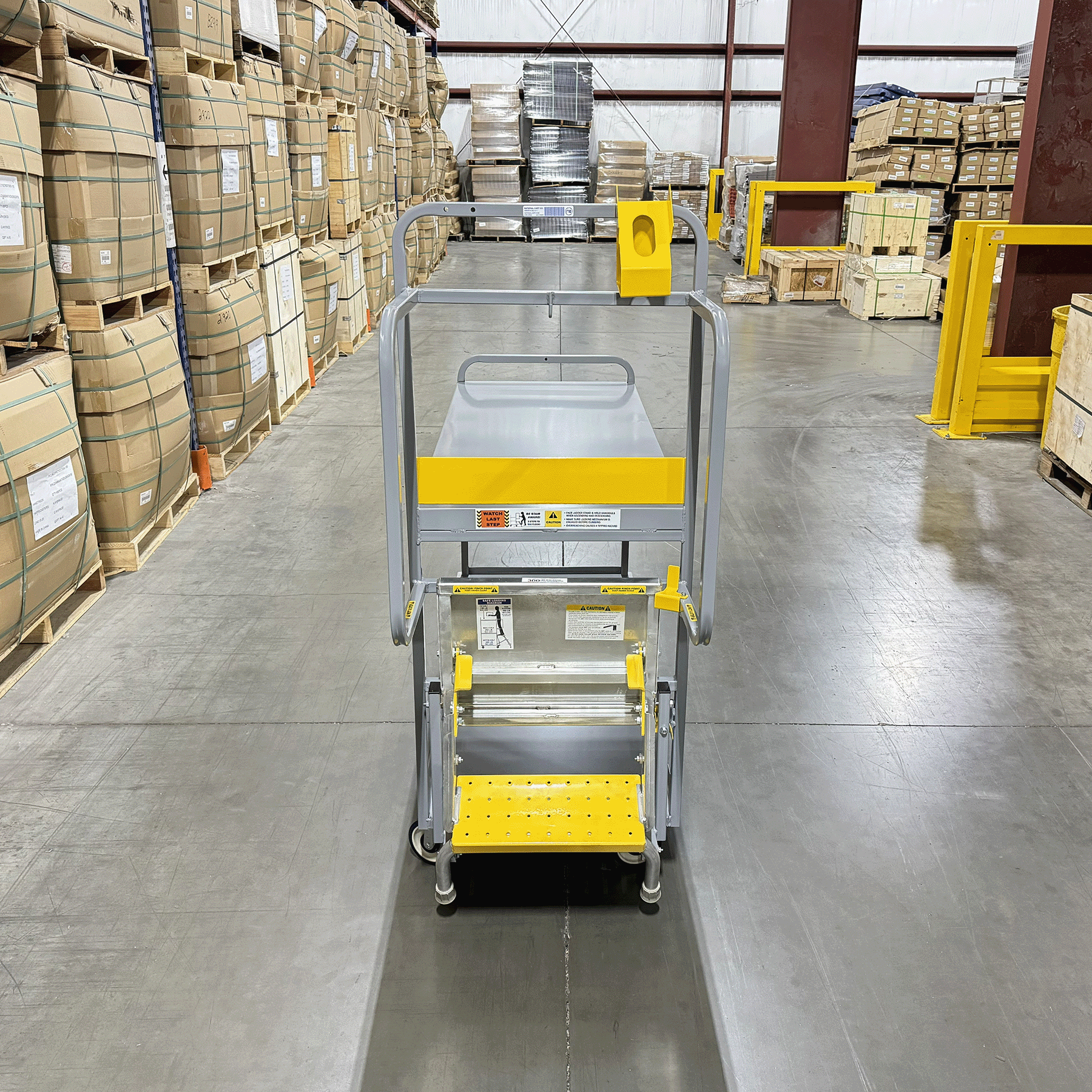 The National Cart 2-Step Stair Cart is designed for stocking and material handling in retail, warehouse, and distribution settings, providing safe access to vertical shelving while transporting items. Key features include a spring-loaded ladder with extra-wide non-slip steps, large handles for balance, a 750 lbs total capacity (model dependent), and heavy-duty steel construction for durability.